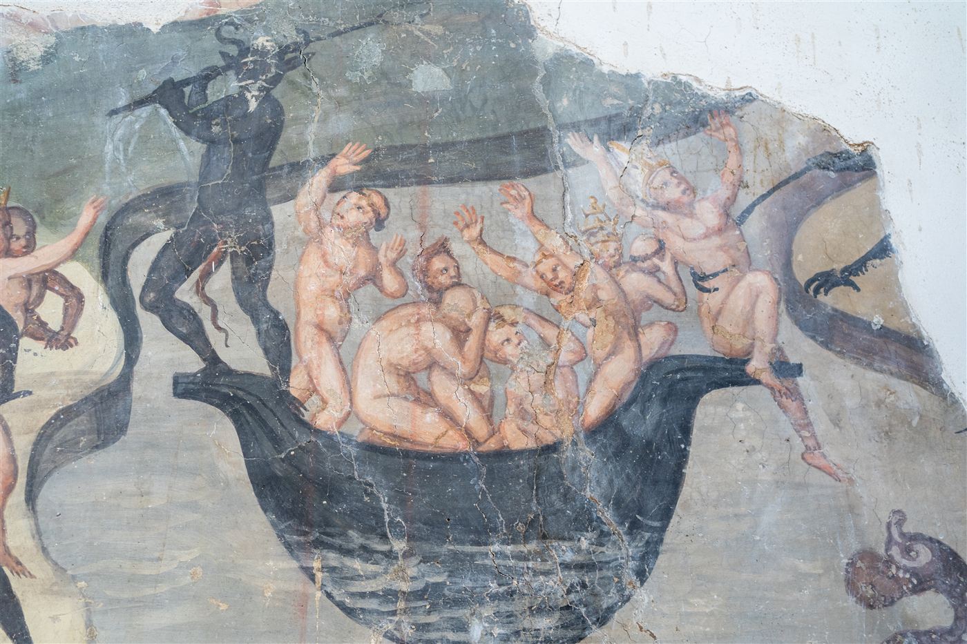 Affresco con un diavolo che rimesta i dannati, alcuni coronati, dentro una grande caldaia